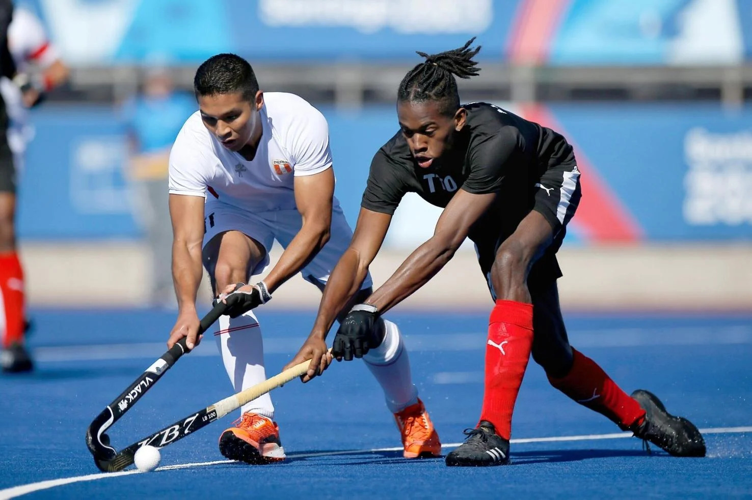 AT FULL STRETCH: TTO’s Teague Marcano, right, is tackled by Peru’s Jefferson Arcos during their 7th to 8th place playoff match at the Centro Deportivo de Hockey Césped yesterday. Marcano top-scored for TTO with six goals to help his team secure a 10-0 victory over Peru and finish in seventh place at the Santiago 2023 Pan American Games.—Photo: PHOTOSPORT / PANAM SPORTS (Image obtained at trinidadexpress.com)