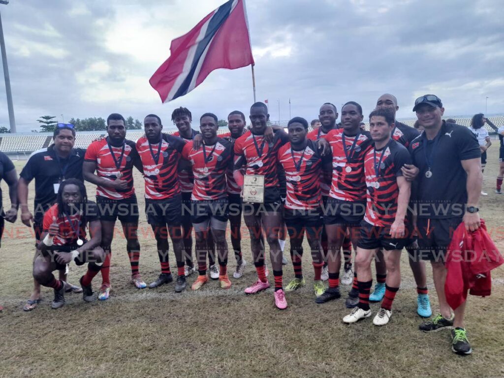 TT rugby men's players and staff celebrate after finishing second in the 2024 Rugby Americas North tournament at the Larry Gomes Stadium in Arima on November 24. Photo by Roneil Walcott (Image obtained at newsday.co.tt)