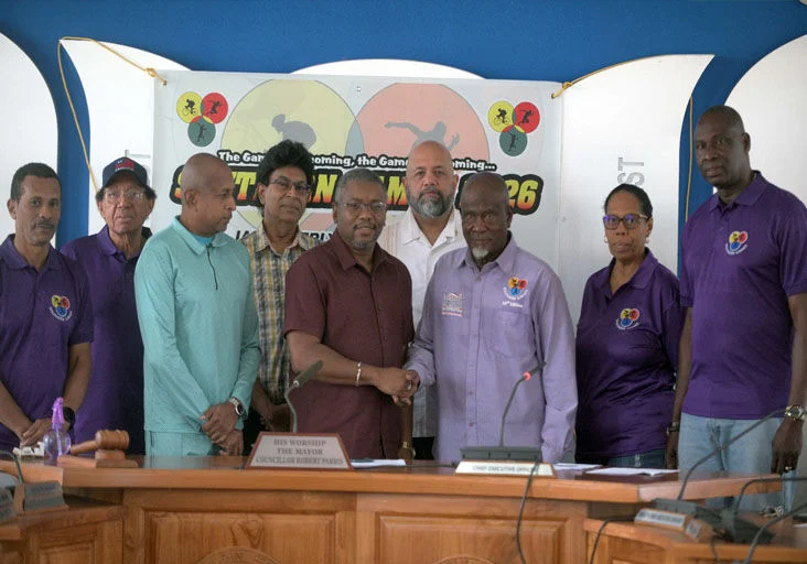 SOUTHERN GAMES LAUNCHED: San Fernando Mayor Robert Parris, centre, shakes hands with Anthony Commissiong, chairman of the Southern Games committee, during the official launch of the Southern Games this week at City Hall, San Fernando. The annual event will be held on Sunday at Skinner Park. Also pictured, from left, are Brian Philmore, PR officer of Southern Games; Novely Bishop, committee member; councillor Rayaad Hosein; committee member Skafte Awardy; secretary Jacqueline Smith and committee member Alvin Daniel. —Photo: DEXTER PHILIP (Image obtained at trinidadexpress.com)